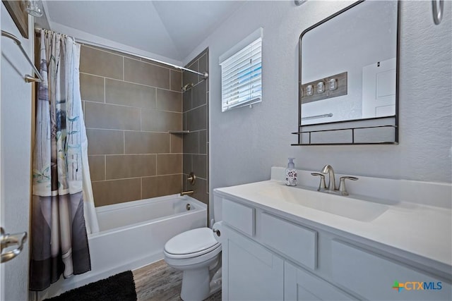 2023 Chilton Hall, San Antonio, TX 78253 - bathroom featuring a textured wall, wood finished floors, toilet, vanity, and shower / tub combo with curtain