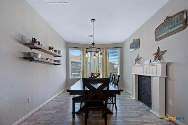 2023 Chilton Hall, San Antonio, TX 78253 - dining area with a chandelier, wood finished floors, visible vents, and baseboards
