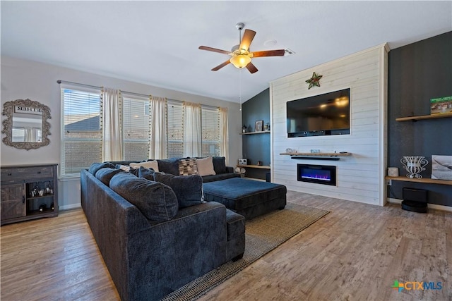 2023 Chilton Hall, San Antonio, TX 78253 - living area with a large fireplace, a ceiling fan, wood finished floors, and baseboards