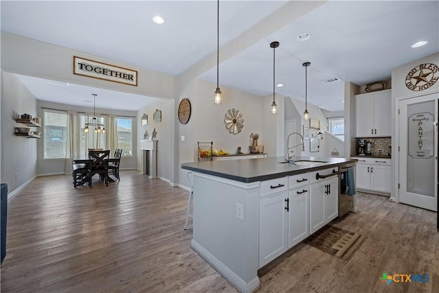 2023 Chilton Hall, San Antonio, TX 78253 - kitchen with a notable chandelier, dark countertops, a sink, and a healthy amount of sunlight