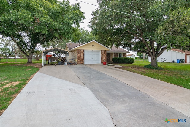 ranch-style home with a garage, a front yard, and a carport