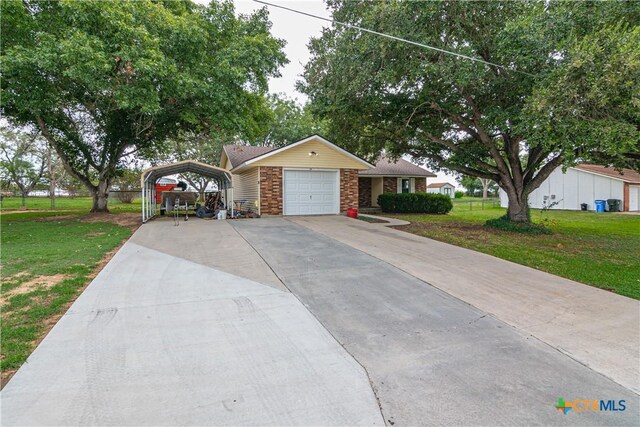 160 Tanglewood Dr, Seguin, TX 78155 - view of front of home with a front lawn, a carport, concrete driveway, and brick siding