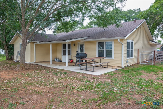 back of property featuring a patio area