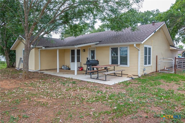 160 Tanglewood Dr, Seguin, TX 78155 - back of house with roof with shingles and a patio