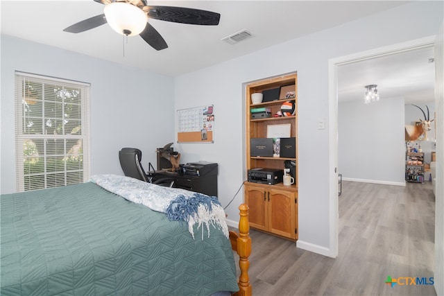 bedroom featuring light hardwood / wood-style flooring and ceiling fan