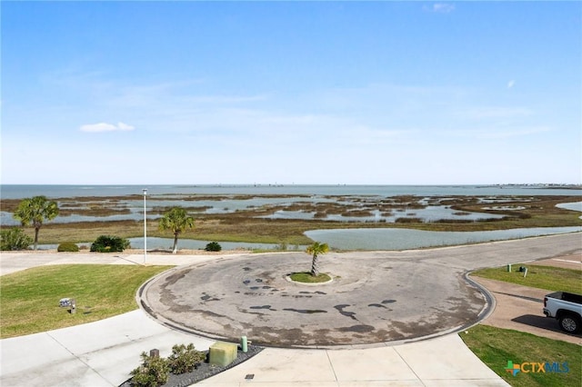 surrounding community featuring a water view