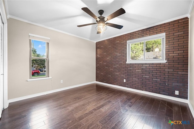 221 W Tanglewood Dr, New Braunfels, TX 78130 - empty room with brick wall, healthy amount of natural light, hardwood / wood-style floors, ornamental molding, and a ceiling fan