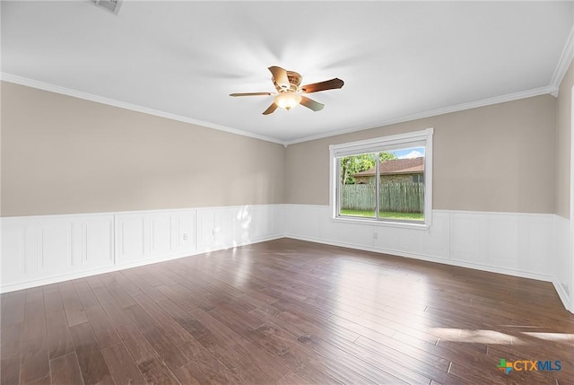 221 W Tanglewood Dr, New Braunfels, TX 78130 - unfurnished room with ceiling fan, wainscoting, dark wood finished floors, and ornamental molding