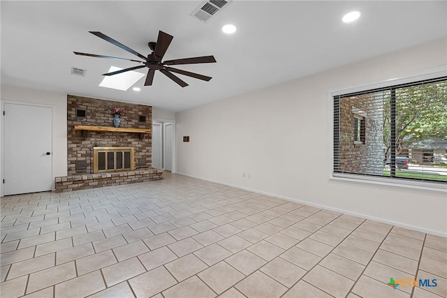 221 W Tanglewood Dr, New Braunfels, TX 78130 - unfurnished living room featuring a ceiling fan, a skylight, a fireplace, recessed lighting, and lofted ceiling