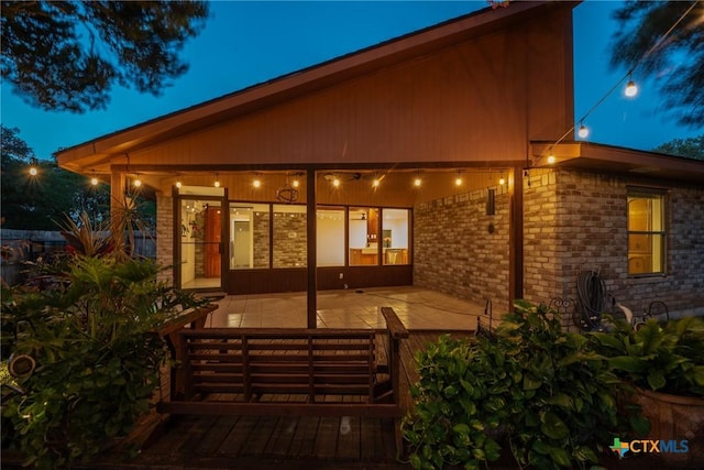 221 W Tanglewood Dr, New Braunfels, TX 78130 - rear view of property featuring a patio and brick siding