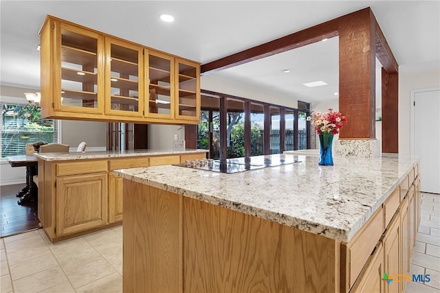 221 W Tanglewood Dr, New Braunfels, TX 78130 - kitchen featuring black electric stovetop, a peninsula, light stone counters, light tile patterned floors, and recessed lighting