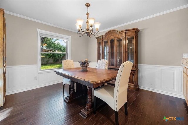 221 W Tanglewood Dr, New Braunfels, TX 78130 - dining space featuring a chandelier, dark wood finished floors, ornamental molding, and a wainscoted wall