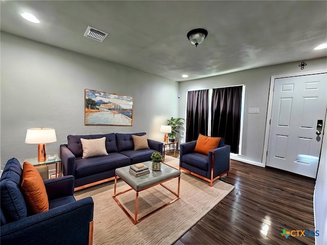 living room featuring dark hardwood / wood-style flooring