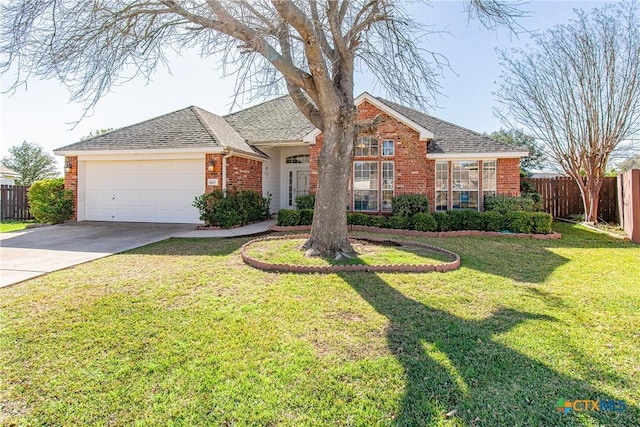 single story home with a garage and a front lawn