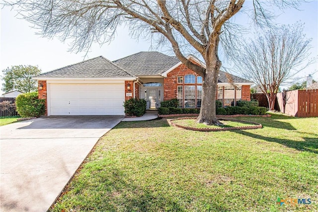 ranch-style house with a garage and a front lawn