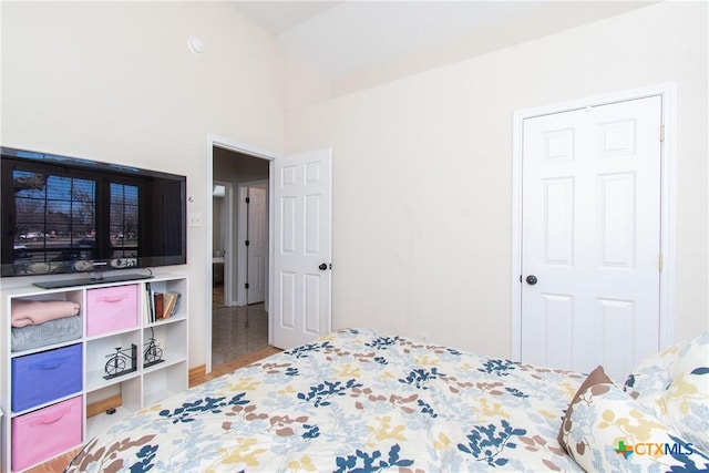 bedroom with lofted ceiling