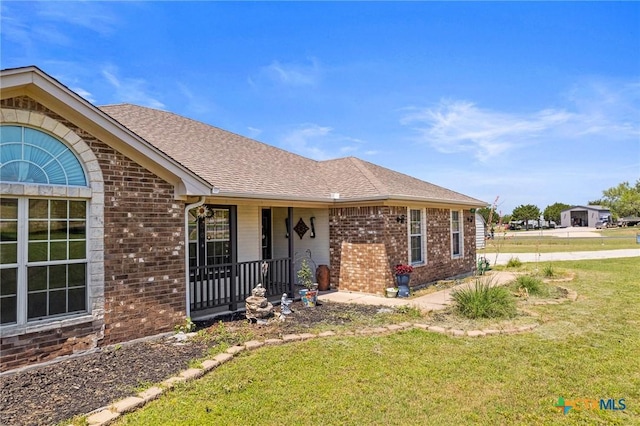 3197 Robin Ln, Kempner, TX 76539 - view of front of property with brick siding, a front lawn, roof with shingles, and a porch