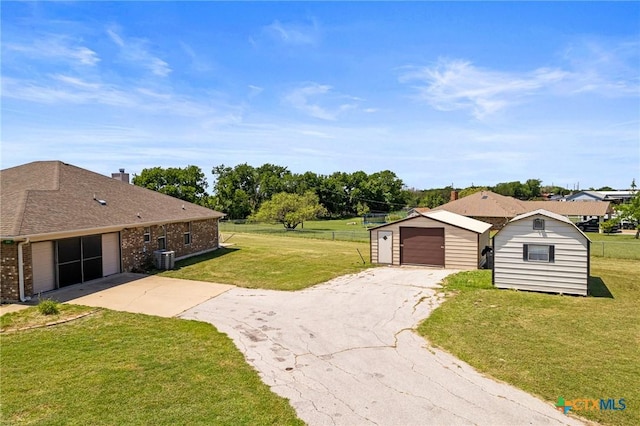 3197 Robin Ln, Kempner, TX 76539 - view of yard featuring an outdoor structure, central AC, and a garage