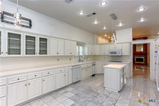 2110 Lakeview Loop, Killeen, TX 76543 - kitchen with white cabinets, a sink, visible vents, light countertops, and white appliances