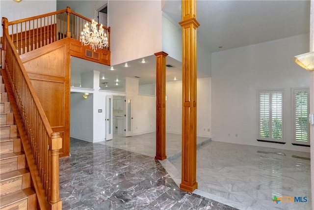 2110 Lakeview Loop, Killeen, TX 76543 - interior space featuring decorative columns, a notable chandelier, a high ceiling, and marble finish floor