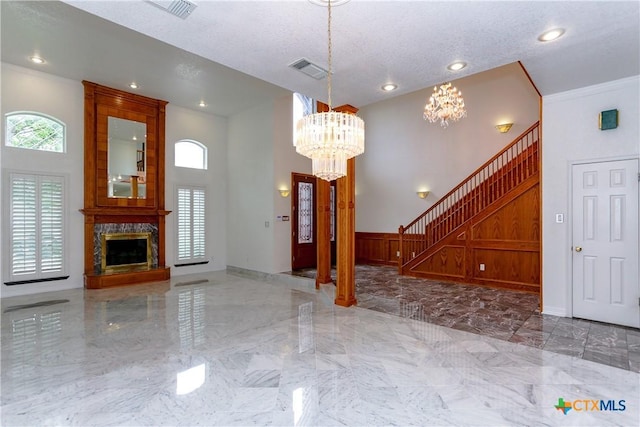 2110 Lakeview Loop, Killeen, TX 76543 - entryway featuring stairway, a chandelier, visible vents, marble finish floor, and a high ceiling