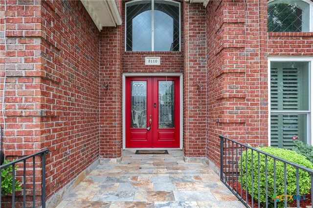 2110 Lakeview Loop, Killeen, TX 76543 - doorway to property featuring french doors and brick siding