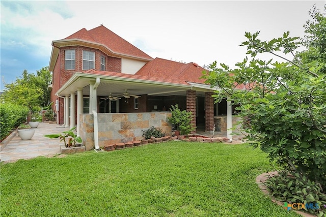 2110 Lakeview Loop, Killeen, TX 76543 - back of property with brick siding, a ceiling fan, a yard, and a patio area