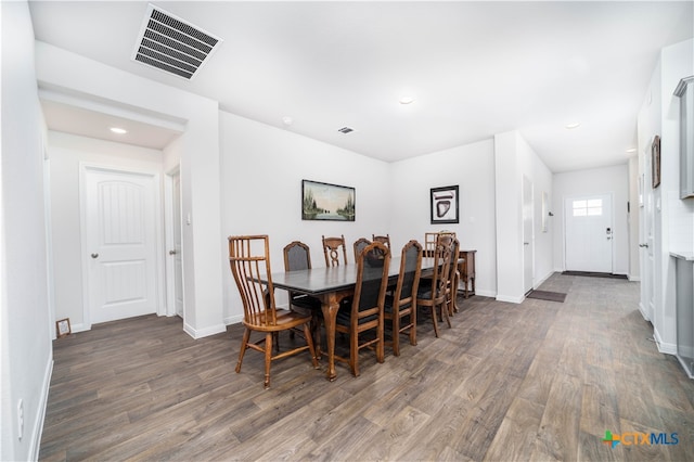 dining area featuring dark hardwood / wood-style floors