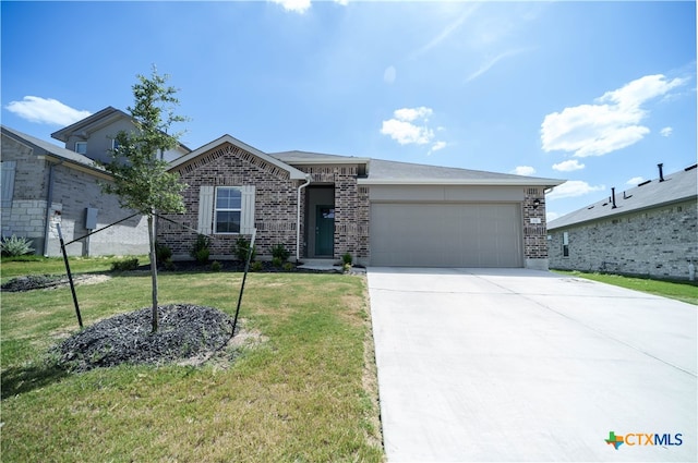 view of front facade with a front lawn and a garage