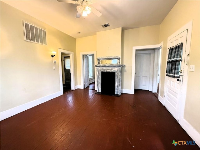 unfurnished living room with ceiling fan and dark hardwood / wood-style floors