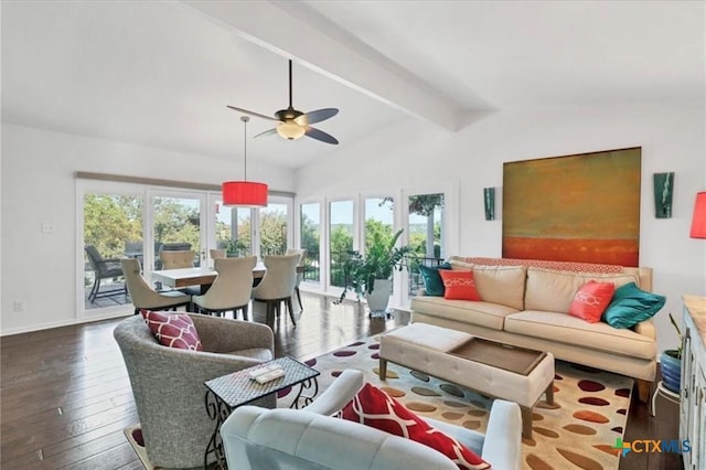 living area with baseboards, a ceiling fan, hardwood / wood-style flooring, and vaulted ceiling with beams