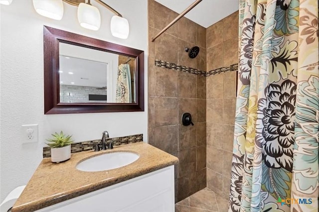 bathroom featuring vanity and a shower with curtain