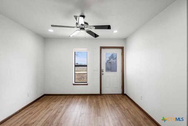 unfurnished room featuring a ceiling fan, recessed lighting, baseboards, and wood finished floors