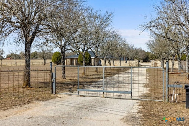 view of gate with fence