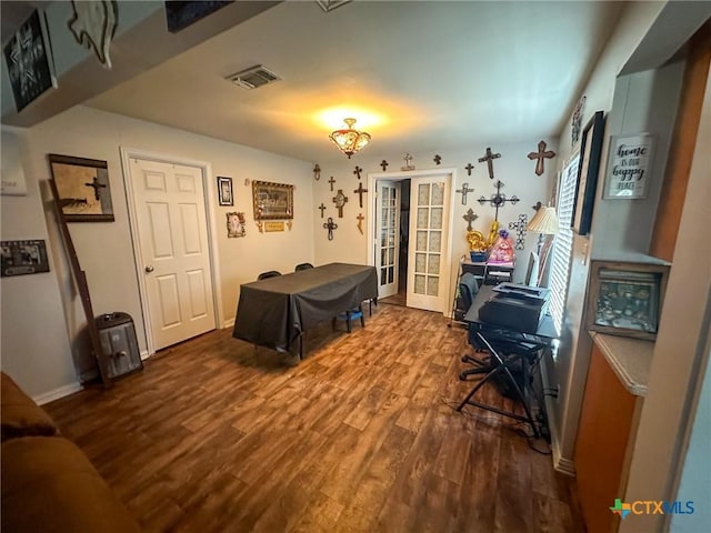 3514 Old Goliad Rd, Victoria, TX 77905 - playroom with wood finished floors, french doors, and baseboards