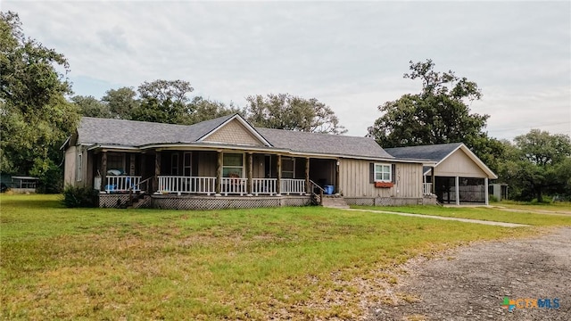 3514 Old Goliad Rd, Victoria, TX 77905 - single story home featuring covered porch, a front yard, and board and batten siding