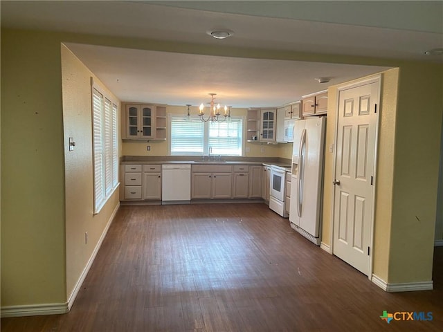 3514 Old Goliad Rd, Victoria, TX 77905 - kitchen with open shelves, white appliances, a chandelier, a sink, and dark wood-type flooring