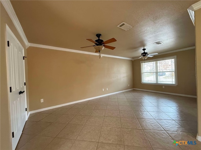 tiled empty room with crown molding, ceiling fan, and a textured ceiling