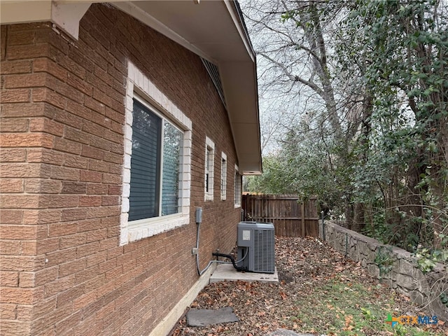 view of home's exterior with cooling unit