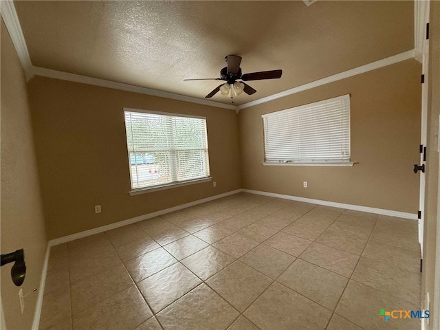 tiled spare room with ceiling fan, ornamental molding, and a textured ceiling