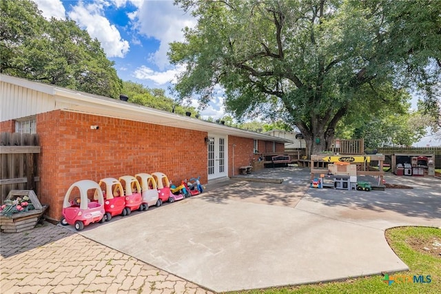 4811 Lilac Ln, Victoria, TX 77904 - view of patio / terrace with french doors and fence