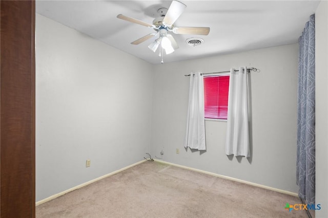 4811 Lilac Ln, Victoria, TX 77904 - unfurnished room featuring carpet, a ceiling fan, and baseboards