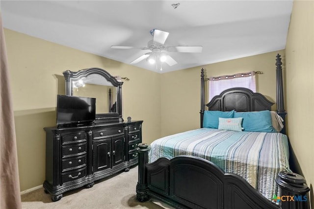 4811 Lilac Ln, Victoria, TX 77904 - bedroom with light colored carpet and a ceiling fan