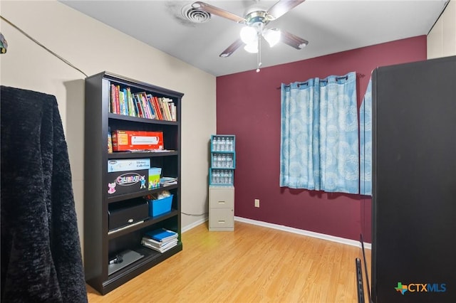 4811 Lilac Ln, Victoria, TX 77904 - misc room with light wood-style flooring, ceiling fan, and baseboards