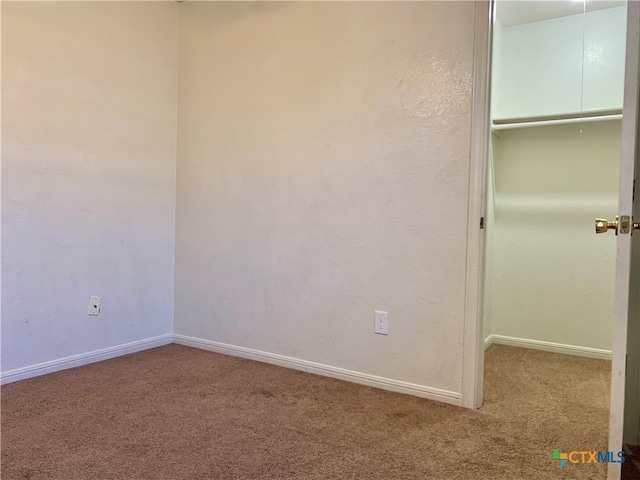 unfurnished bedroom featuring carpet