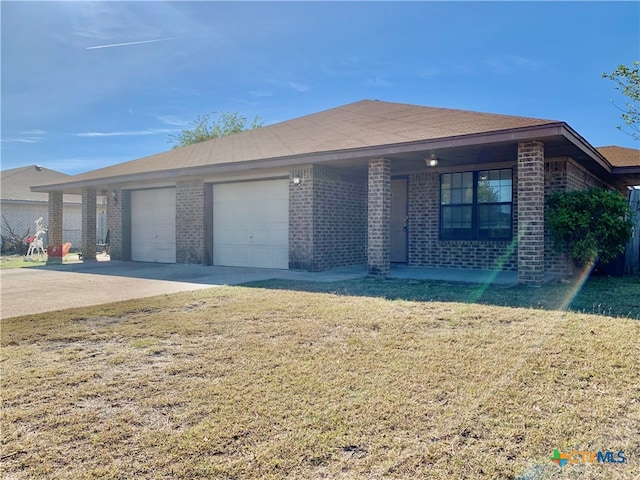 ranch-style house featuring a front yard and a garage