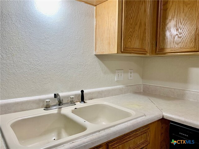 interior space featuring black dishwasher and sink