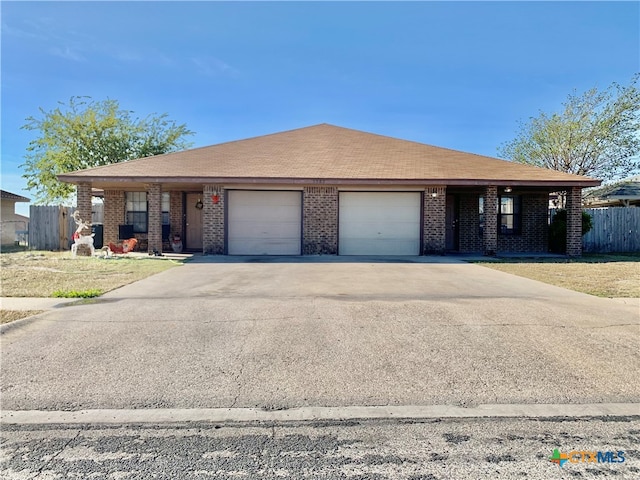 view of front of property with a garage