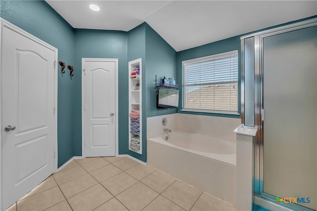 bathroom with tile patterned floors and plus walk in shower