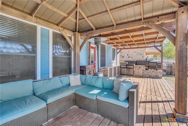 deck featuring outdoor lounge area, area for grilling, and a gazebo